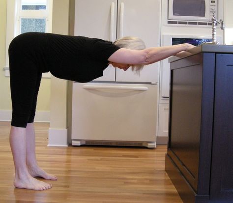 This week’s Five-Minute Yoga Challenge is spinal stretch at the kitchen counter. It’s an easy one to tuck into your day – come into the kitchen, put the kettle on, and while the water boils, put your hands down on the counter and step back into spinal stretch. It has a special meaning for me, … Kitchen Counter Exercises, Side Plank Yoga Sequence, Yoga After Spinal Fusion, Back Yoga Stretches, My First Teacher, Yoga Moves, Changing Habits, Move Your Body, Loving Your Body