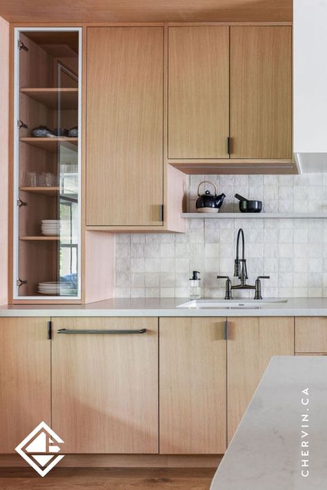 An earthy, natural and modern kitchen with rift-cut white oak cabinetry and silver edge-pulls and handles. Natural Modern Kitchen, Modern Cottage Kitchen, White Oak Kitchen Cabinets, Slab Cabinets, Glass Kitchen Cabinets, White Oak Kitchen, Frameless Cabinets, Walnut Kitchen, Oak Kitchen Cabinets