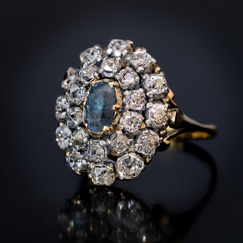 Antique 19th Century Russian Alexandrite Diamond Cluster Ring, Circa 1870. This antique Victorian era cluster ring is finely crafted in 14K gold and silver. The ring is centered with a rare Russian alexandrite (approximately 0.75 ct), surrounded by two rows of chunky old mine cut diamonds.  The alexandrite changes its color from pinkish purple to bluish green when seen under different light. The diamonds are set in silver over gold. Estimated total diamond weight is 2.40 ct. 19th Century Jewelry, Antique Jewelry Rare, Victorian Rings Vintage, Antique Rings Victorian, Vintage Cluster Ring, Alexandrite Jewelry, Pearl Engagement Ring, Jewelry Drawing, Antique Diamond Rings