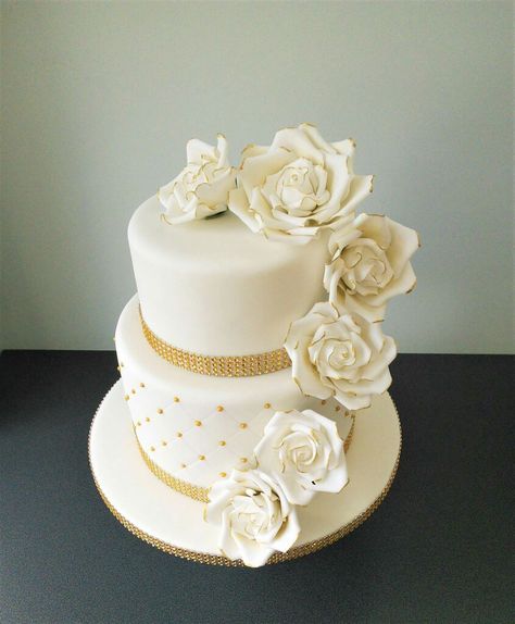 Golden wedding two tier cake with white and gold roses White 2 Tier Cake, Wedding Cake Olive, Wedding Cake Gold Leaf, Wedding Cake Two Tier, Two Tier Wedding Cake, Golden Wedding Cake, Golden Wedding Anniversary Cake, White And Gold Wedding Cake, 2 Tier Wedding Cakes