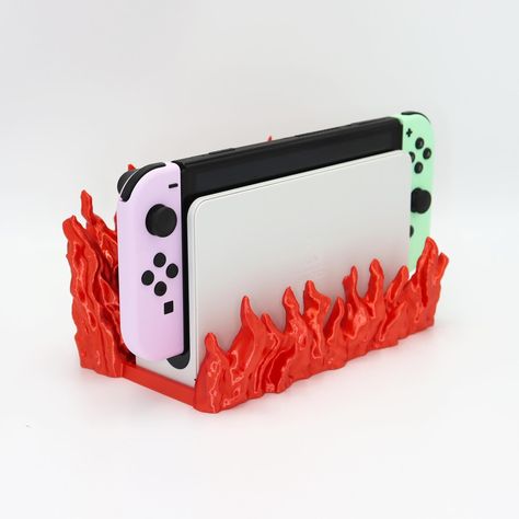 Here is Flame Nintendo switch dock, download and 3d print it yourself now https://than.gs/m/1060168 Oled Nintendo Switch, Nintendo Switch Dock, Small Printer, Trophies And Medals, Original Nintendo, Toy Boat, Canned Heat, Construction Toys, Tabletop Rpg