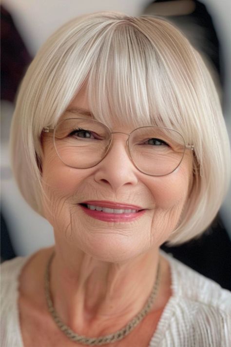 Short Rounded Bob with Bangs Hairstyle for Women Over 70 with Glasses. Bob Hair With Bangs Round Face, Short Stacked Bob Haircut Fine Hair With Bangs, Short Bob With Bangs Hairstyles, Soft Bob With Bangs, Rounded Bob Haircut With Bangs, Short Hairstyles With Bangs Round Face, Women Over 70 Fashion, Short Bob Cuts For Women, Bangs For Older Women With Glasses