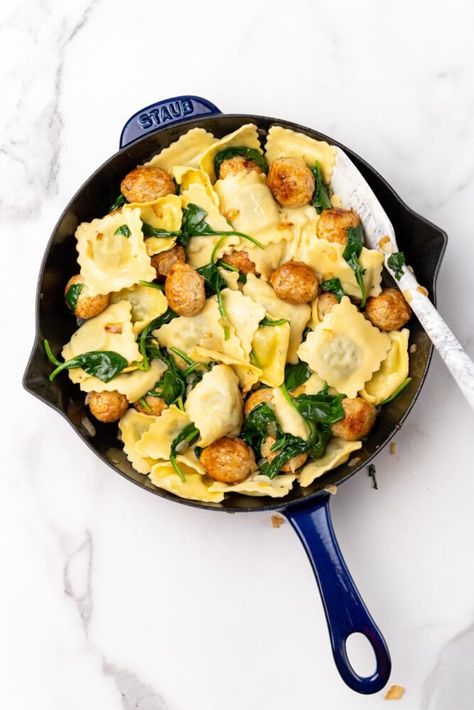 Blue staub skillet with ravioli, meatballs and spinach. Ravioli And Meatballs, Easy Ravioli, Meatballs Dinner, Spinach Meatballs, Spinach Ravioli, Meatball Dinner, Main Dish Casseroles, Ravioli Recipe, One Skillet