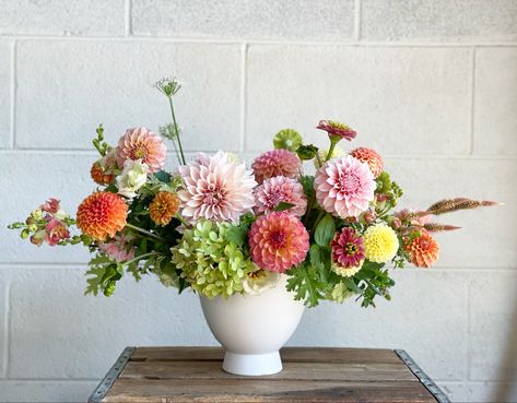 Gorgeous centerpiece in white, matte ceramic compote vase. Filled with season, summer blooms - dahlias, zinnias, hydrangea and snapdragons. All locally grown in Asheville. Perfect for a romantic, garden inspired wedding. Dahlia Wedding Centerpieces, Compote Arrangement, Dahlia Centerpiece Wedding, Dahlia Centerpiece, Compote Vase, Centerpiece Inspiration, Garden Inspired Wedding, Dahlias Wedding, Samantha Wedding