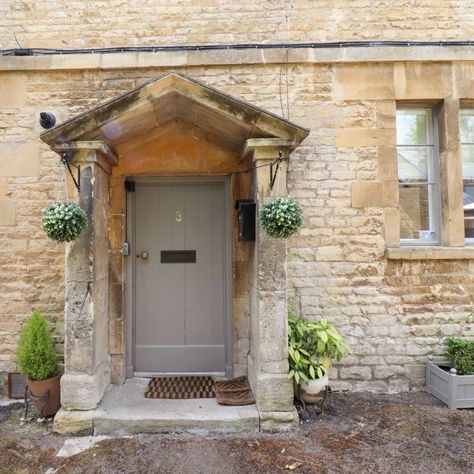 Front door to No. 3 Blockley - a charming vacation rental in the Cotswolds. Rosehill Cottage, Cozy Window Nook, Cottage Front Doors, Front Door Inspiration, English Country Cottages, Rattan Planters, Cotswolds Cottage, Porch Uk, Wicker Planter