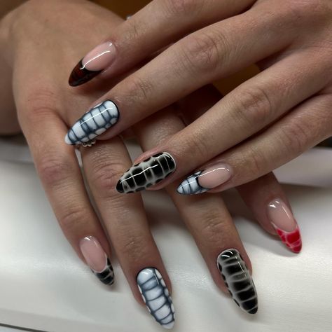 It’s giving Black Widow! 🕷️ A black and white color scheme with some pops of red. Blooming gel was used to create a crocodile pattern across the nails. This is a structured manicure using Luminary Nail Systems “Faith” as the base. Service: Structured Manicure & Art #luminarynailsystems #luminarynails #luminarytech #luminaryfaith #nailtech #naturalnails #naturalstilettonails White And Black Crocodile Nails, Black And White Blooming Gel Nails, Black And White Crocodile Nails, Blooming Gel Nails Fall, Black Blooming Gel Nails, Black Crocodile Nails, Natural Stiletto Nails, Structured Manicure, Blooming Gel Nails