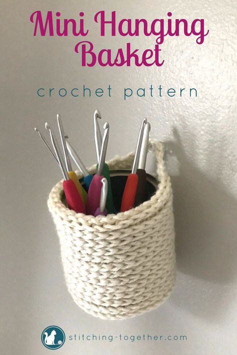 Adorable crochet mini hanging baskets you can make with this free crochet pattern. Perfect to hold crocht hooks, pen, brushes or fold it down to hold keys or tape! The mini baskets can be hung on the wall or placed on a desk. Imagine how cute they would look in your office! #crochet #crochetbasket #freepatterns #crochetpattern #crocheting #stitchingtog #freecrochetpattern #minibasket #diy Terico Basket, Office Crochet, Mini Baskets, Crochet Storage Baskets, Crochet Basket Pattern Free, Patterns Flowers, Basket Crochet, Crochet Storage, Crochet Basket Pattern