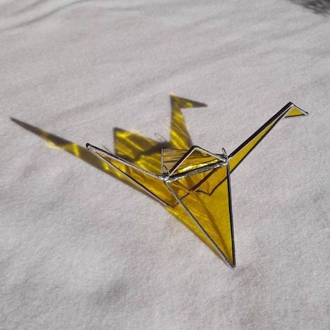 A Stained Glass Origami Crane brings peace, good fortune and get well wishes. The 3D hanging bird can sit on a window ledge or bookcase. #stainedglass #origamiglasscrane #Graphixglass https://etsy.me/3IeQ42k Stained Glass Origami, Window Ledge, Get Well Wishes, Foil Tape, Well Wishes, Origami Crane, Copper Foil, Amethyst Purple, Colour Star