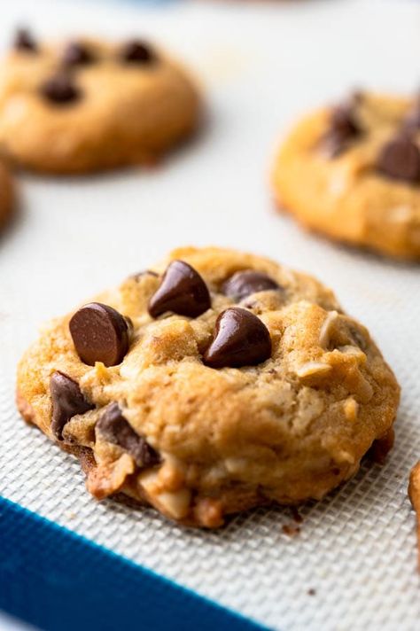 These easy to make, soft and chewy chocolate chip cookies are loaded with semi sweet or dark chocolate chips, sweetened flaked coconut, toasted almonds and a browned butter batter that makes them irresistibly warm and nutty. The unusual method in this recipe makes thick, chunky cookies you'll love. Great for holiday cookie swaps, gift exchanges, cookie boards or for Santa himself. #chocolatechipcookies #chewychocolatechipcookies Cookies Chewy, Chocolate Chip Cookie Recipes, Averie Cooks, Chewy Peanut Butter Cookies, Soft Chocolate Chip Cookies, Double Chocolate Chip Cookies, Peanut Butter Chocolate Chip Cookies, Peanut Butter And Chocolate, Chewy Chocolate Chip