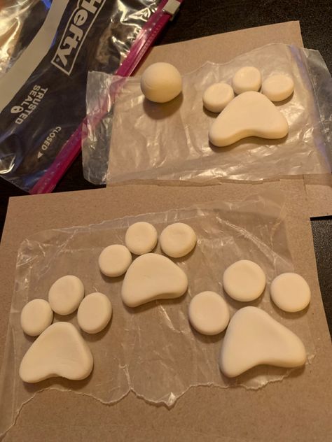 Paw prints shaped out of white satin fondant for granddaughter’s 3rd birthday Paw Patrol cake! Make a triangle out of fondant, then round the corners and use your knuckle to make an indentation across the bottom. Then roll 3 small balls of fondant and flatten with your finger to make the complete paw print. Fondant Paw Prints, Paw Patrol Paw Print, Paw Patrol Crafts, 3rd Birthday Paw Patrol, Birthday Paw Patrol, Paw Patrol Cake, Dog Cakes, Fondant Tutorial, Patrol Party