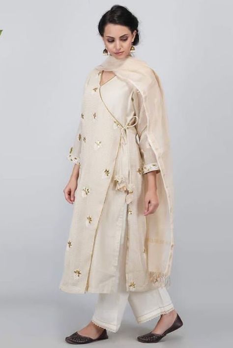 Beautiful Angrakha style Chanderi-Silk  kurti. Embellished with hand embroidery. Angrakha Style Suits For Women, Angarkha Style Kurti Designs, Angrakha Style Kurti Straight, Angrakha Style Shirt, Angrakha Style Kurti, Angrakha Style Anarkali, Palazzo Outfits, Shirt Kurti, Long Kurta Designs