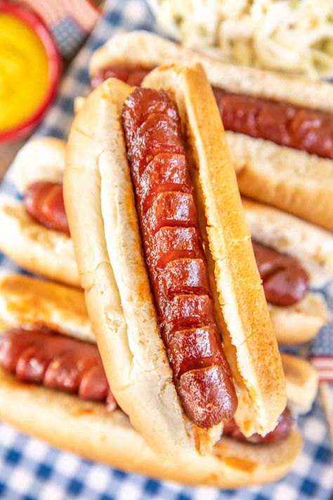 Slow Cooker BBQ Hot Dogs - the best hot dogs EVER! Super easy and they taste great! Hot dogs slow-cooked in a quick homemade sauce of ketchup, BBQ sauce, Worcestershire sauce, brown sugar, vinegar, and onion powder. Slice the hot dogs on two sides so they absorb more of the sauce - YUM! Great for cookouts, tailgating, and parties. #slowcooker #crockpot #hotdogs Hotdogs In Crockpot, Bbq Hot Dogs, Mini Hotdogs, Dogs Recipes, Field Meals, Ultimate Mac And Cheese, Bbq Sauce Homemade Easy, Best Baked Beans, Hot Dog Sauce