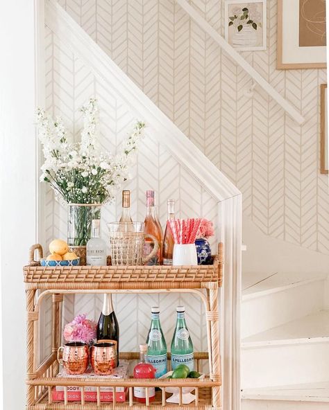 Rattan bar carts to usher in the cocktail hour. The bar carts in use today reemerged in the 50s and 60s—the era of cocktail parties. Bar Cart Inspo, Bar Cart Essentials, Apartment Bar, Rattan Bar Cart, Rattan Bar, College House, Bar Cart Styling, College Apartment Decor, College Room