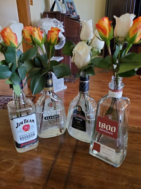 Alcohol Centerpieces Parties, Alcohol Themed Party Decorations, Empty Liquor Bottle Ideas, Alcohol Themed Party, Alcohol Table, Liqour Bottles, Fireball Bottle, Alcohol Decor, Old Liquor Bottles