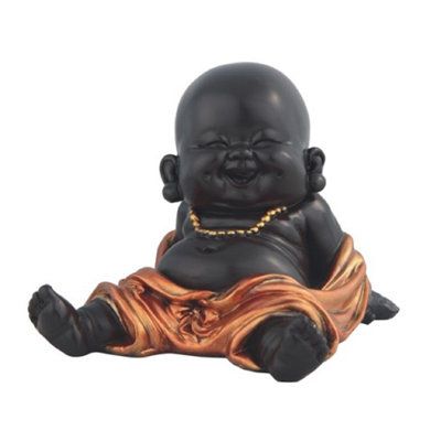 This buddha figurine has the highest quality and is perfectly sized to fit in any room. This piece will make an eye-catching addition for your display shelves, desktops, or office decor. You will fall in love instantly with this stunning figurine. Sweet decoration for your home, and perfect gift choice for your loved ones. | Dakota Fields Zachery Little Buddhist Monk Statue Feng Shui Figurine Resin in Black/Yellow, Size 4.0 H x 3.5 W x 3.0 D in | Wayfair | Home Decor Black Statue, Feng Shui Decoration, Small Buddha Statue, Baby Buddha, Art Buddha, Buddha Decor, Little Buddha, Sweet Decoration, Buddha Zen