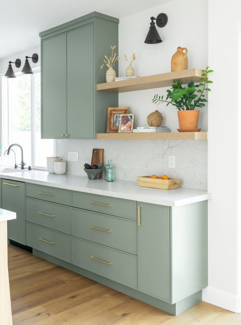 The soft green cabinets combined with the various earth toned accents make this kitchen eye-catching!  #Lenoreinar #realestate #realtor #nwa #nwarealestate #conciergerealtynwa Soft Green Cabinets, Moving Ideas, Wood Range Hood, Road House, Farmhouse Inspiration, Dream Kitchens, Green Cabinets, Smart Kitchen, Brown Living Room