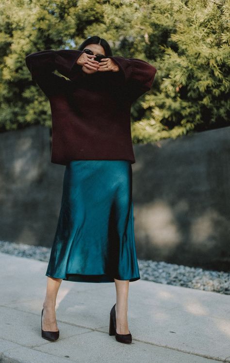 Winter Outfit Idea In A Satin Slip Midi Skirt Bias Skirt Outfit Winter, Teal Satin Skirt Outfit, Black Silk Skirt Outfit Summer, Wrap Dress Outfit Winter, Black Satin Skirt Outfit Summer, Blue Satin Skirt Outfit, Satin Skirt Outfit Winter, Black Skirt Winter, Slip Dress Outfit Winter