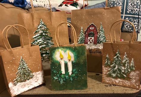 I used plain paper gift bags, acrylic paint and clear varnish spray. The bags in the picture depict Christmas/winter scenes. Decorate Gift Bags For Christmas, Painted Christmas Gift Bags, Painted Gift Bags, Christmas Bag Decorating Ideas, Christmas Brown Bag Ideas, Christmas Gift Bags Diy, Decorate Brown Paper Bag For Christmas, Painted Gift Bags Christmas, Hand Painted Green Bags For Gift