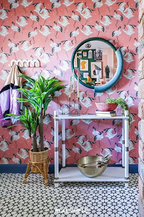 7 Genius Ways to Decorate an Entryway Table | Carissa Henderson embraced pattern and color when designing her small entryway. The designer and Instagrammer behind A Bold New Hue instead brought her love of saturated shades and quirky motifs to the space, crane wallpaper with a sleek white entryway console table. #realsimple #entrywayideas #modernhomedecor #budgetfriendlyhomedecor #homeinspo Maximalist House, Eclectic Entryway, Dining Room Murals, Cement Tile Shop, Bookcase Diy, Shell Chandelier, Maximalist Style, Wood Slat Wall, Entryway Table Decor