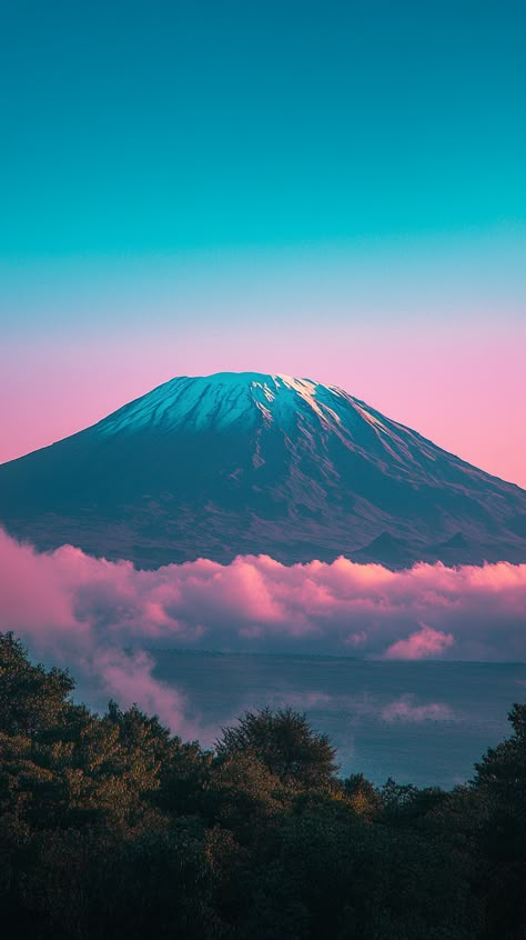 The snow-capped Mount Kilimanjaro standing tall against the African landscape. Travel Wallpaper Aesthetic, Climbing Kilimanjaro, Kilimanjaro Tanzania, Adventure Wallpaper, Sky Scenery, Unique Vacation Rentals, Unique Vacations, Serengeti National Park, Destin Hotels