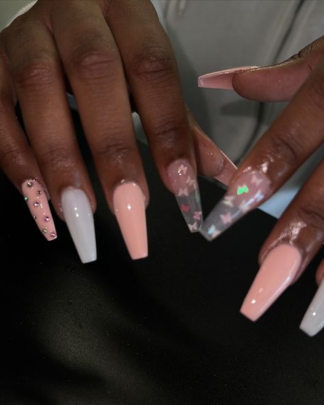 Obsessed with these pink coffin nails featuring butterfly encapsulated designs! 🦋✨ Perfect for adding a little pretty touch to your summer style. Let us elevate your nail game 💅🏽 #lanailtech #carsonnails #longnails #theynotlikeus #PinkCoffinNails #ButterflyNails #NailArt #ManicureMagic #NailGoals #NailInspo #SummerNails #NailDesigns #pinknails #whitenails Pink Butterfly Nails, Medium Coffin Nails, Pink Coffin Nails, Pink Coffin, Encapsulated Nails, Medium Coffin, Butterfly Nails, La Nails, Instagram Nails