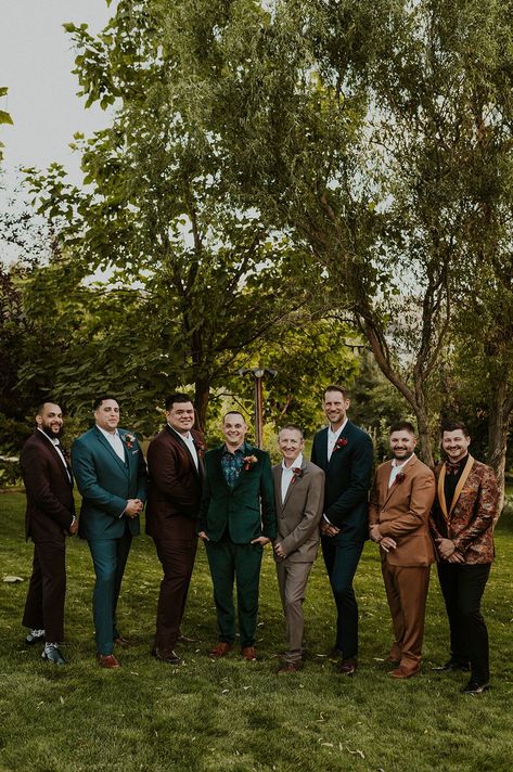 Mismatched Jewel Toned Groomsmen Suits #groomsmen #groomsmensuits #mensfashion #menstyle #retrowedding #70swedding #weddingideas #retrofashion #menssuits #mensuits #groom #groomsmenpose #groomsenphoto #fallgroom #fallweddingaesthetic #fallwedding #outdoorwedding #weddingparty #weddingdesign #fallweddinginspo #fallweddingideas #emeraldgreen #weddingcolors #fallweddingcolors #jewelcolors #fallcolors #fallcolorpalette #fallweddinginspo #groomsmenphotos Mixed Color Groomsmen Suits, Groomsmen In Different Colors, Groomsmen Velvet Jacket, Boho Mens Wedding Attire Mismatched Groomsmen, Autumn Groomsmen Suits, Groomsmen Multicolor, Cottagecore Groomsmen, Groomsmen Jewel Tone, Fantasy Wedding Groomsmen