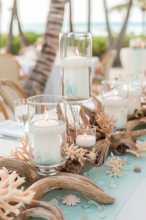 Driftwood centerpieces bring a natural, coastal element to your wedding decor. Get inspired here. Ocean Table Decorations, Dock Wedding Ceremony, Driftwood Centerpieces, Driftwood Wedding Centerpieces, Desert Themed Wedding, Coastal Wedding Flowers, Beach Themed Weddings, Coastal Wedding Ideas, Beach Table Decorations