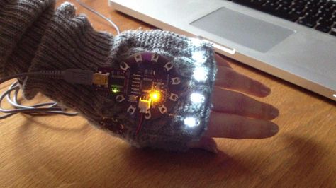 LilyPad Arduino - sensing ambient temperature. A LilyPad Arduino wrist warmer.  The wrist warmer has a temperature sensor and five LEDs sewn... Lilypad Arduino, Smart Clothing, Conductive Thread, Smart Outfit, Arduino Projects, Wearable Tech, Wrist Warmers, Cool Tech, Fade To Black