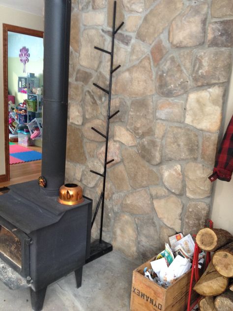 Clothes drying rack behind fireplace.  My husband is so handy.  Just give him a problem to solve and a couple hours later, voila! Fireplace Drying Rack Ideas, Wood Stove Clothes Drying Rack, Fireplace Drying Rack, Wood Stove Drying Rack, Wood Stove Accessories, Sunroom Daybed, Diy Clothes Drying Rack, Indoor Clothes Lines, Child Gate