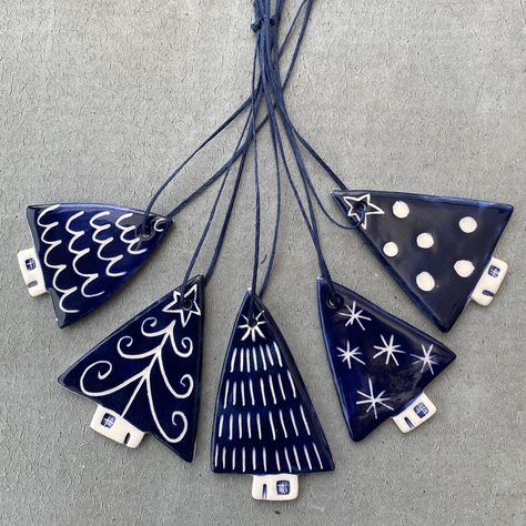 Each decoration is hand made from white earthenware clay, decorated with coloured slips and a hand drawn scraffito design. Navy cotton thread is attached to allow the decorations  to be hung.  made from: White earthenware clay and ribbon.  dimensions: Each decoration measures  approx between 4 - 5cm x approx between 3-4cm    (excluding thread )  Please note that designs, sizes and colours may vary slightly from the photo as they are all individually made and therefore unique.  Free postage. Air Dried Clay Christmas Decorations, Christmas Ornaments Pottery, College Christmas, Pottery Idea, Christmas Ceramics, Clay Christmas Decorations, Ceramic Christmas Decorations, Hygge Christmas, Scandinavian Christmas Decorations