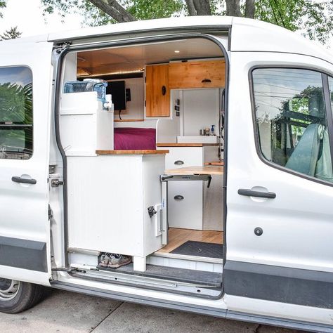 Living and storage ideas in a diy ford transit van conversion. Read this #vanlife blog for advice for how to build your own campervan conversion! Tricks for adding a bathroom, toilet, kitchen and cozy living area! Tips for how to find free camping and solar panel wiring and plumbing diagrams for living in a van full time! Ford Transit Rv, Ducato Camper, Ford Transit Van Conversion, Living In A Van, Transit Van Conversion, Transit Camper Conversion, Ford Transit Camper Conversion, Ford Transit Conversion, Ford Transit Campervan