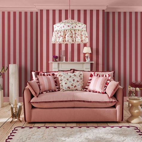 Simply charming. Canopy Stripe Pink & Red will have no issues bringing light-hearted fun into any home. This matt finish wallpaper is the perfect combination of timeless and contemporary, with its distinct wide stripe design in a beautifully bold colour palette of cranberry red and baby pink, for an eye catching pop of colour. So, if you fancy trying something a little different on your walls, Canopy Stripe Pink & Red might just be the one for you.  The Cath Kidston wallpaper collection brings 4 Pink Red Wallpaper, Cath Kidston Wallpaper, Seaside Aesthetic, Striped Tile, Nina Campbell, Bold Color Palette, Wallpaper Direct, Wallpaper Collection, Striped Wallpaper