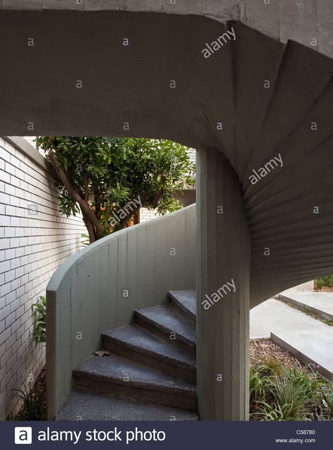 Download this stock image: Modern concrete external spiral staircase. - C58780 from Alamy's library of millions of high resolution stock photos, illustrations and vectors. Concrete Spiral Staircase, Stairs To Basement, Spiral Staircase Dimensions, Stairs Concrete, Staircase Drawing, Curved Stairs, Spiral Stairs Design, Concrete Exterior, Stair Gallery