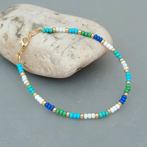 Multicolour Blue Green Seed Bead Bracelet with Gold or Silver Highlights Seed Bead Jewellery, Tiger Tail, Green Beaded Bracelets, Bead Suppliers, Blue Green Gold, Seed Bead Bracelet, Bead Ideas, Bracelet Ideas, Green Sea