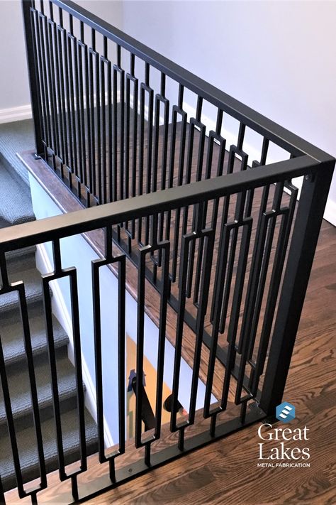 A modern rail design in a rectangle pattern is coated in oil-rubbed bronze in a newly renovated home. Iron Staircase Railing, Woods Home, Iron Balcony Railing, Steel Railing Design, Metal Fencing, Metal Railing, Gate Wall Design, Staircase Railing Design, House Main Door Design