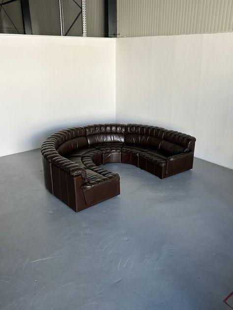 A stunning seven-part Mid-Century Modern leather U-shape sectional sofa, produced in the late 1970s in West Germany, and following the style of the De Sede DS-600 Non Stop stofa, designed by Ueli Berger, Eleanora Peduzzi-Riva, and Hans Ulrich. A 1970s statement of comfort and quality. Unknown West Germany production. Sourced from the original owners who had it from 1979.  The seven modules of the sofa are completely independent and can be connected with straps. The leather has been professionally cleaned and protected. Easy maintenance. The sofa is in its original vintage condition and very well preserved, with minimal expected signs of age. Structurally perfect. Two modules have smaller cat scratches from the household of the original owners, indicated in the photos. DIMENSIONS: Middle (c Modern Leather Sectional, U Shaped Sectional Sofa, Modular Seating, Salon Suites, Leather Sectional Sofa, Apartment Decor Inspiration, Dream Apartment, Leather Sectional, Couch Furniture