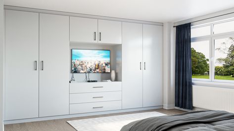 Stunning modern grey fitted wardrobes with entertainment area for the TV White And Grey Closet, Tv And Wardrobe Design, Wardrobe Design Bedroom Tv, Fitted Wardrobe Ideas With Tv, Fitted Wardrobes With Tv, Built In Wardrobe Ideas With Tv, Wardrobe Tv Bedroom, Tv Closet Bedroom, Wardrobe Design Bedroom With Tv