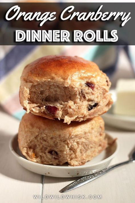 Orange Cranberry Dinner Rolls made with part whole wheat flour, flavored with orange zest and filled with dried cranberries throughout.  #wildwildwhisk #dinnerrolls #dinnerrollsrecipe #thanksgivingdinnerrolls #thanksgivingsides Thanksgiving Dinner Rolls, Dried Cranberries Recipes, Egg Bread, Hot Cross Buns Recipe, Orange Cranberry, Sweet Buns, Dinner Rolls Recipe, Soft Orange, Hot Cross Buns