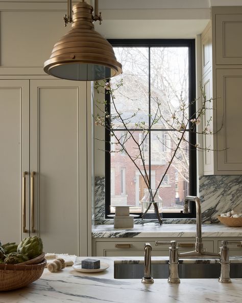 Similar to framing a work of art, painting the window frames black draws your eye in and adds that much needed contrast against the creamy cabinetry. Design: Black Sheep Interior Design Build: Ratcliffe and Black Millwork: Heritage Kitchens Photo: Lauren Miller Styling: Stacey Smithers Black Window Kitchen, Heritage Kitchen, Lauren Miller, Bridge Faucet, Hand Spray, Kitchen Windows, Cabinetry Design, Kitchen Photos, Window Frames