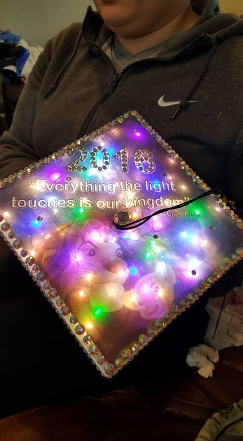 My daughter's graduation cap I decorated for her......with the lights on  Lion King graduation cap College Grad Cap Ideas, Graduation Cap Decoration Diy, Adhesive Fabric, High School Graduation Cap, College Graduation Cap Decoration, Grad Hat, Senior Stuff, Space Craft, Grad Caps