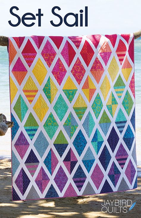 Meet my latest pattern, Set Sail! This quilt is all about diamonds and triangles that have fun together and make for great movement across the quilt top.  Quilt Details Fabric is True Colors by Tula P Jaybird Quilts, Quilt Modernen, Quilt Sewing Patterns, Rainbow Quilt, Quilt Care, Patchwork Quilt Patterns, Triangle Quilt, Contemporary Quilts, Diy Quilt