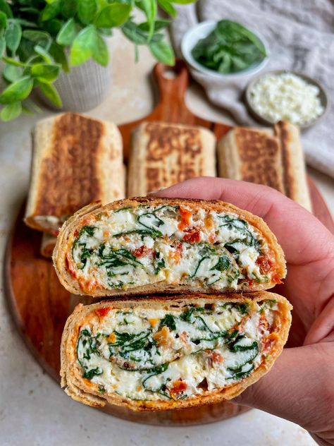 This spinach feta egg white wrap recipe is the best Starbucks copycat recipe that you need to add to your meal prep rotation. These wraps are light yet satiating, protein packed and so much better made at home!    This post contains affiliate links   One of my favorite menu items to get from Starbucks is their is their Spinach, Feta and Egg White Wrap. But at $5.35 a pop, enjoying this delicious breakfast can make a real dent in the monthly food budget.  That is why I decided to start making the Starbucks Egg White Spinach Feta Wrap, Starbucks Spinach Feta Wrap Recipe, Spinach Feta Egg White Wrap, Egg Wrap Ideas, Spinach Egg Wrap, Spinach Feta Wrap, Spinach Feta Egg, Egg Whites Wrap, Pineapple Shrimp