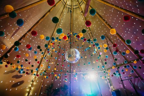 Tipi Pom Poms Disco Ball Church Farm Wedding Andrew Brannan Photography #TipiWedding #PomPoms #DiscoBall #Wedding Tipi Wedding Decor, Wedding Pom Poms, Festival Style Wedding, Festival Themed Wedding, Tipi Wedding, Whimsical Wonderland Weddings, Disco Balls, Marquee Wedding, Barn Wedding Venue