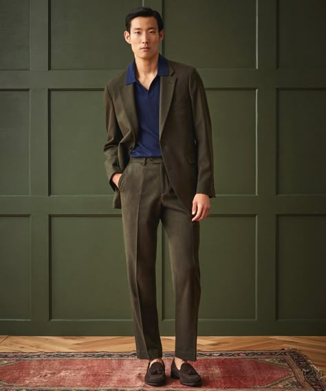 Our signature Sutton Trouser offers a twist on the traditional tailored suit pant. It has a moderate rise and flat front and falls straight through the hip to taper through the thigh and knee for a modern, slim fit. The fabric is a soft flannel, with all the character but none of the itchiness of the classics, woven fr Modern Suits Men, Men Suit Outfit, Dark Green Suit, Green Suit Men, Vintage Suit Men, Olive Green Suit, Brown Suede Loafers, Modern Suits, Flannel Suit