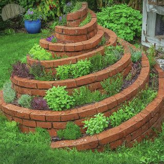 The Herb Gardener: How to Make an Herb Spiral Spiral Garden Bed, Brick Herb Garden, Spiral Brick Garden, Spiral Garden Design, Herb Spiral Garden, Superbowl Party Decorations, Charcoal Kitchen, Herb Spiral, Spiral Garden