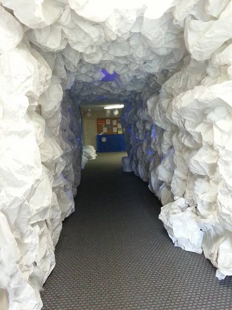 Ice Cave Design This ice cave is made from a 3' wide roll of white butcher paper I purchased from Staples. https://www.staples.com/product_150058 The hallway is 4' wide and the walls are 8' tall. I used double that amount for each strip of paper up and around the cave. It took a total of between 800 and 900 feet of paper. The paper is held in place with staples. This paper does not reflect black light so I added polyester fiberfill to get it to glow. Ice Themed Party, Arctic Decorations, Operation Arctic Vbs, Ice Decorations, Arctic Vbs, Mountain Wedding Ideas, Cave Design, Ice Mountain, Book Fairs