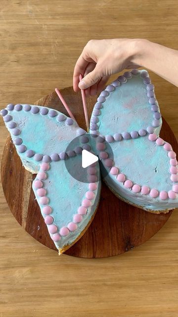 Sheri Wilson on Instagram: "Butterfly Ice-cream Cake! 🦋🎂 perfect for a summer party! This was easier than I was expecting and super cute! All you need is a tub of icecream, a layer of cake, and candy to decorate!  1. Line a large round pan with cling wrap and add your icecream- remember to pack it down. (I used cotton candy flavor) 2. Add a layer of cake the same size as the pan and freeze overnight. 3. Turn out the icecream cake on a serving platter, cut down the middle, then turn the edges inwards. 4. Decorate with M&M’s for the wings, pocky sticks for the antenna, and a wafer cookie for the body.  Freeze well before serving!   #icecream #summerrecipe #icecreamdessert #easyrecipe #easydessert  #icecreamcake #summerparty #icecreamparty" Spring Sweets, Wafer Cookie, Grinch Cake, Pocky Sticks, Fancy Dishes, Cotton Candy Flavoring, Wafer Cookies, Kids Party Food, Spanish Rice