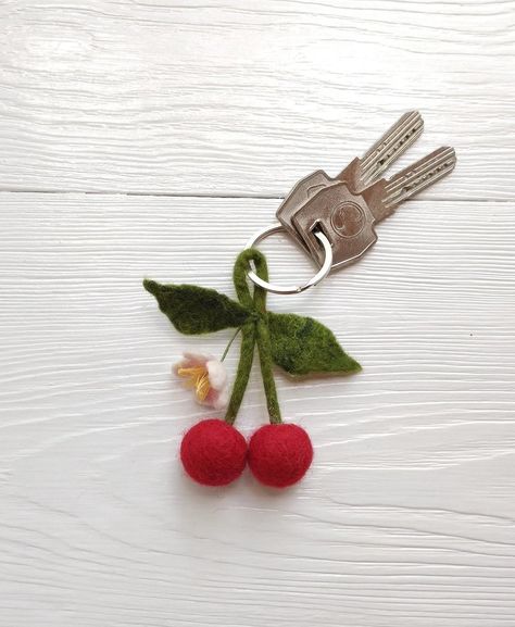 "This a wool cherry with blossom is a felted keychain. Felted cherry with a flower is attached to the ring. Such a cute felt key ring is a beautiful and fashionable thing. It can also be a wonderful little gift for a good person. 3.5\" keychain length together with ring." Needle Felt Keychain, Felt Knitting, Felted Keychains, Felted Keychain, Diy Chairs, Embroidery Cases, Felted Wool Slippers, Felt Keychain, Anniversary Keychain