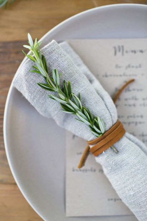 a napkin accessorized with rosemary and a leather cord to make it more eye catchy Spring Garden Party, Festive Table Setting, Rustic Wedding Decorations, Outdoor Dinner Parties, Tafel Decor, Rosemary Sprigs, Outdoor Dinner, Leather Wedding, Festive Tables