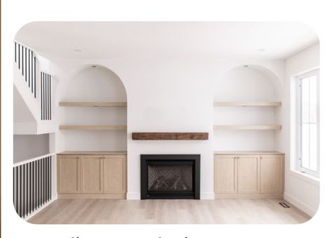 Arched Alcoves Living Room, Arches Next To Fireplace, Spanish Style Built Ins, Arched Built Ins Living Room Fireplace, Lounge Room Shelving Ideas, Arch Entertainment Center, Living Room With Built In Shelves, Arch Media Wall, Arched Alcove Ideas Living Room